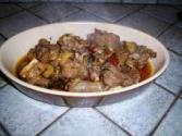 Angioni cun gureu e cancioffa (Agnello con cardi e carciofi )
